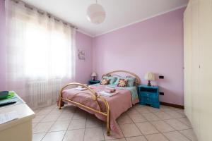 Postel nebo postele na pokoji v ubytování Alice Mercadini B&B