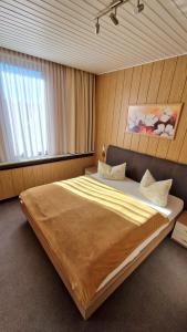Letto o letti in una camera di Pension Am Kirschberg