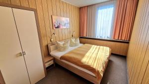 Letto o letti in una camera di Pension Am Kirschberg
