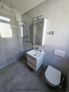 Koupelna v ubytování Apartment and room Anica