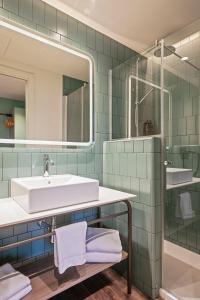 Koupelna v ubytování Hotel Via Augusta
