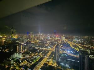 a view of a city at night with traffic at Trion Kuala Lumpur For KLCC view BLOCK C in Kuala Lumpur