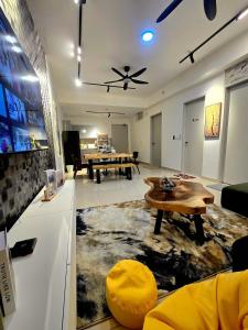 a living room with a couch and a table at Trion Kuala Lumpur For KLCC view BLOCK C in Kuala Lumpur