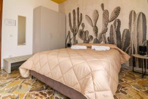 En eller flere senge i et værelse på Casalicia Acireale