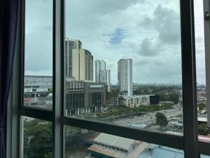 a view of a city from a window at Rainforest City House Paradigm Skudai UTM TVBox in Johor Bahru
