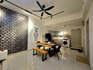 a dining room with a table and a ceiling fan at Trion Kuala Lumpur For KLCC view BLOCK C in Kuala Lumpur