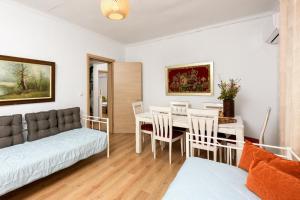 a living room with a couch and a table at Adamou Family House in Prinos