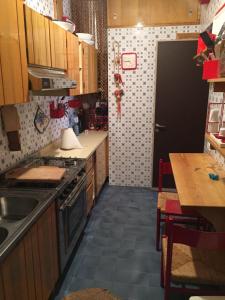 a kitchen with a sink and a stove top oven at Beautiful sea front beach in Granitola