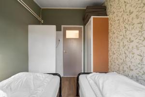 Postel nebo postele na pokoji v ubytování Vakantiehuis Pico Bello - Callantsoog aan Zee
