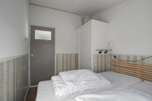 Postel nebo postele na pokoji v ubytování Vakantiehuis Pico Bello - Callantsoog aan Zee