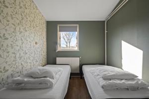 Postel nebo postele na pokoji v ubytování Vakantiehuis Pico Bello - Callantsoog aan Zee