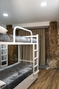 Postel nebo postele na pokoji v ubytování Albergue San Nicolás