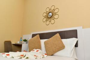 Postel nebo postele na pokoji v ubytování Sun City Accomodation