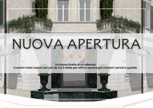 a window of a building with the words nyonza opera at Hotel Belvedere in Forte dei Marmi