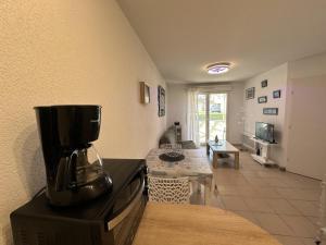 a kitchen with a coffee maker on top of a appliance at Adour e vita in Pontonx-sur-lʼAdour
