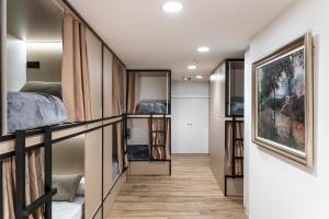 Postel nebo postele na pokoji v ubytování Albergue San Nicolás