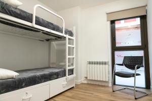 Postel nebo postele na pokoji v ubytování Albergue San Nicolás