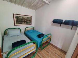 Voodi või voodid majutusasutuse Finca las Orquideas toas