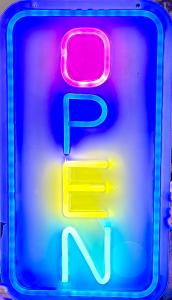 a neon sign that says p and n at Wenzil Taylor Building in Spillville