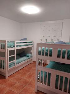 two bunk beds in a room with at La Labranza del Bosque in El Bosque