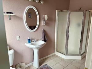 a bathroom with a sink and a shower at Wenzil Taylor Building in Spillville +25 photos