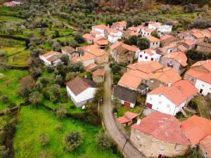 an aerial view of a village with red roofs at Casa de Aldeia Vale do Mondego in Guarda