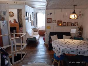 a room with a bed and a table in it at Casa de Aldeia Vale do Mondego in Guarda