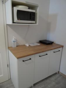 Kuchnia lub aneks kuchenny w obiekcie La Mer Pokoje i Apartamenty