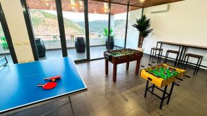 a room with a blue table and a table sidx sidx sidx at Casas Colgadas Alcalá del Júcar in Alcalá del Júcar