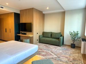 TV a/nebo společenská místnost v ubytování Resident Hotel Abay