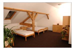 Postel nebo postele na pokoji v ubytování Penzion Daniela