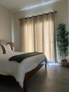 Ένα ή περισσότερα κρεβάτια σε δωμάτιο στο cozy apartment