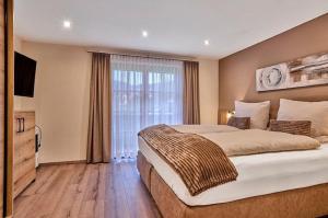 En eller flere senge i et værelse på Ferienwohnungen Kuchler