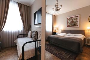 Postel nebo postele na pokoji v ubytování Forums Boutique Hotel