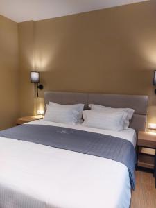 Postel nebo postele na pokoji v ubytování Mulaj Hotel