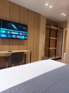 TV a/nebo společenská místnost v ubytování Mulaj Hotel