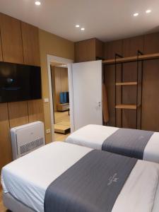 Postel nebo postele na pokoji v ubytování Mulaj Hotel