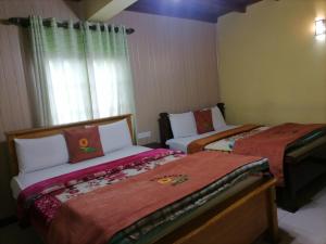 Postel nebo postele na pokoji v ubytování Himawari Hills