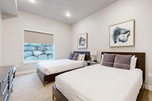 a bedroom with two beds and a window at 304 - Black Rock Mountain Resort in Heber City +42 photos