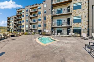 a large apartment building with a swimming pool in a courtyard at 304 - Black Rock Mountain Resort in Heber City