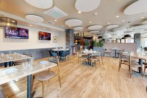 a dining room with tables and chairs at 304 - Black Rock Mountain Resort in Heber City