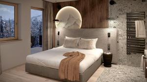 Кровать или кровати в номере Hotel Tirolerhof 4 Sterne Superior
