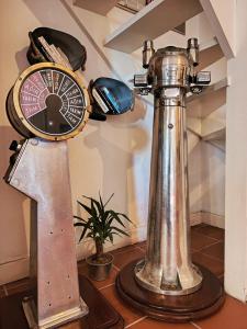 a clock sitting on top of a table at Berlin's Guest House in Urla +15 photos
