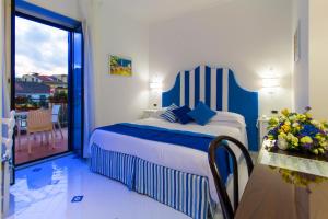 Krevet ili kreveti u jedinici u okviru objekta Hotel Villa Di Sorrento