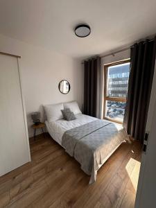 Ένα ή περισσότερα κρεβάτια σε δωμάτιο στο A63 by Real Apartment