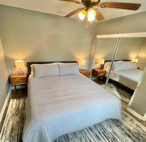 a bedroom with two beds and a ceiling fan at Posh Pad in Marion