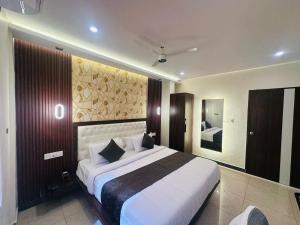Letto o letti in una camera di Mysore Elite