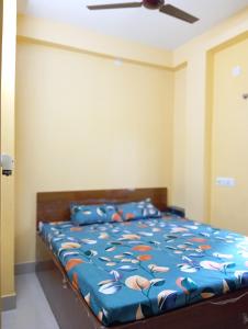 Postel nebo postele na pokoji v ubytování Rukmini Guest House