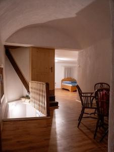 a room with a staircase and a bed in a room at Sigma house in Mojstrana