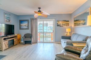a living room with a couch and a ceiling fan at Sea Pond Villa Unit 3 in Myrtle Beach